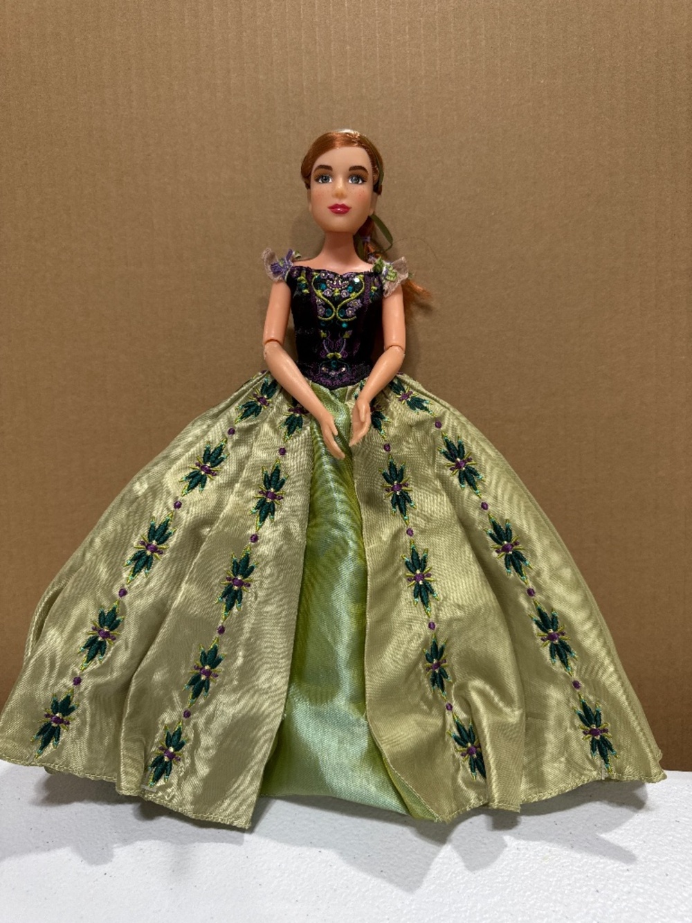 Fashion doll with styled reddish-brown hair